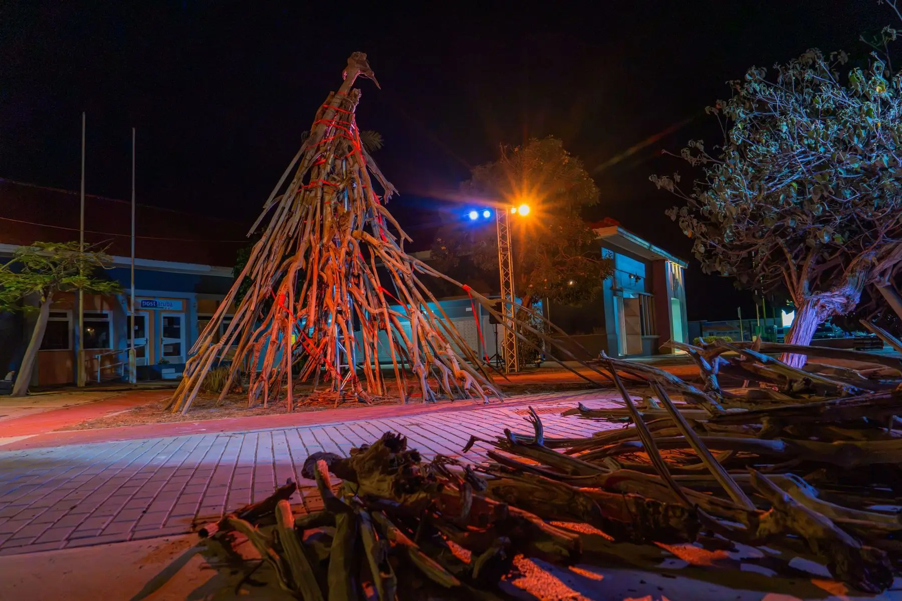 Red tree at Aruba Art Fair 2026 in San Nicolas